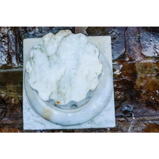 Piece of column on a Carrara marble base, decorated with an "antique ruin" style garden.