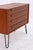 Vintage teak chest of drawers from WK Möbel with four spacious drawers and striking, long handles. The compact body rests...