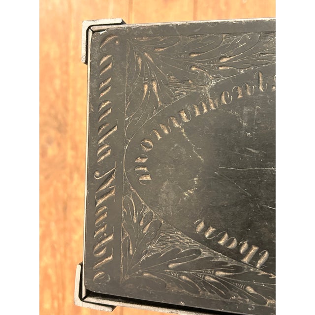 One of a kind cleverly made narrow rectangular side table having a found vintage carved marble top in black and grey with...
