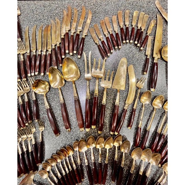 Vintage Siam flatware and cutlery set in brass and rosewood. A large set of vintage flatware in good condition. Each piece...