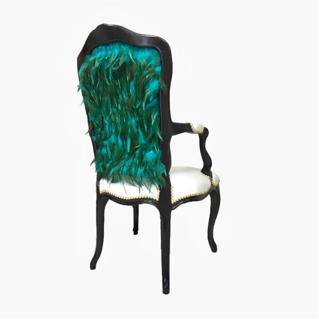 High– back French style open-arm chair with intricate floral carved details, midnight black finish. Luxurious faux mink...