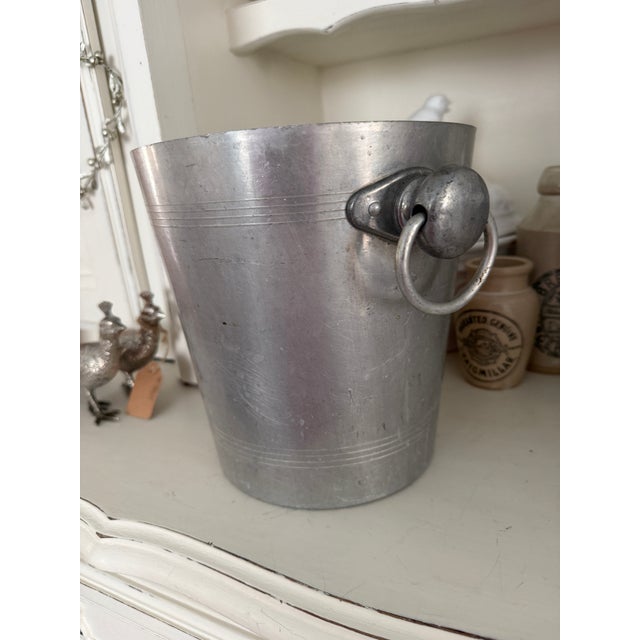 A classic vintage French champagne bucket featuring the bold red H. Germain label, sourced in France and dating to the...