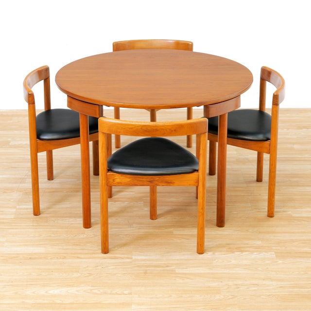 An iconic Danish modern dining set designed by Hans Olsen. This sought-after “Roundette” table and chairs was produced in...