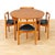An iconic Danish modern dining set designed by Hans Olsen. This sought-after “Roundette” table and chairs was produced in...