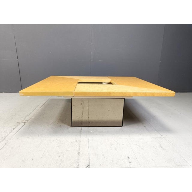 Ash wood coffee table designed by paul michel. This luxurious coffee table is cleverly designed and slides open to reveal...