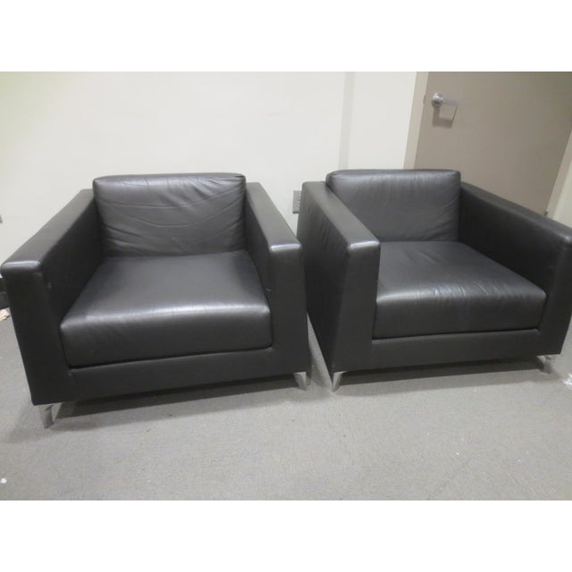 The Bernhardt Design Lounge Chairs in black offer a sleek, contemporary look with a focus on comfort and clean lines. This...