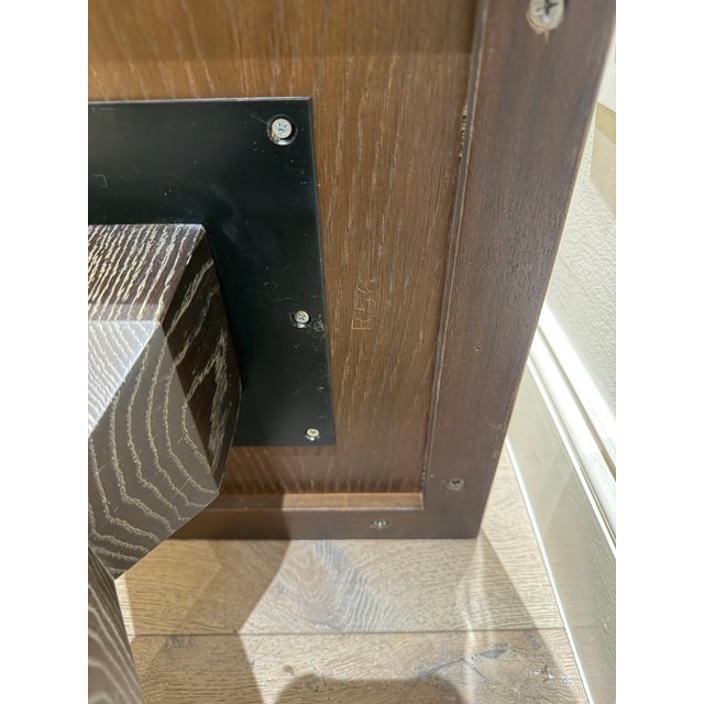 Original Donghia Jean-Michel Frank Collection square pedestal table in oak. Features the signature faceted geometric...