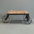 "Farmer Table" custom made by Denver woodworker Jim Guerin. The wheels are found objects that have been powder coated...