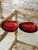 A striking pair of vintage Asian clam shell-form trinket boxes finished in richly layered lacquer with warm shades of...