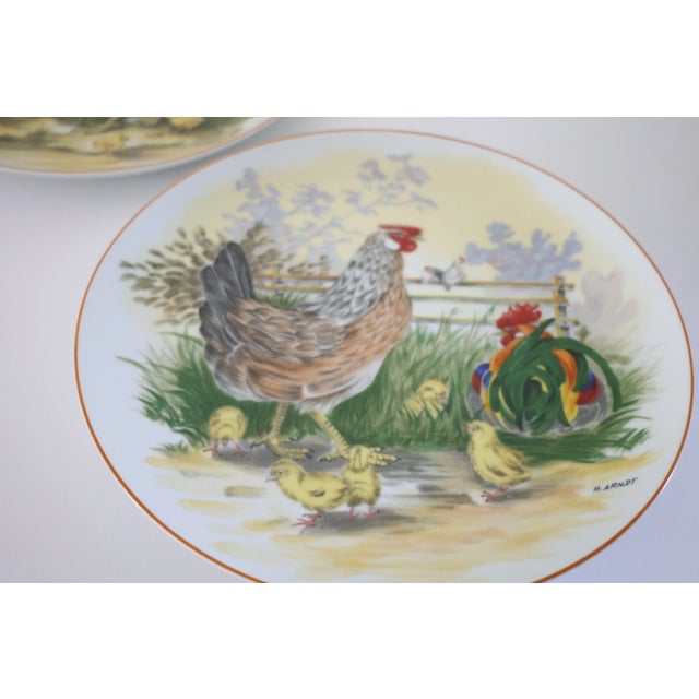 Bring the warmth and whimsy of the countryside to your space with this charming set of two vintage rooster and hen plates...