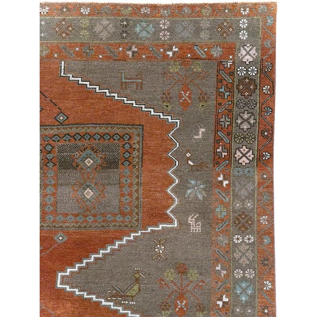 This mid-20th-century Turkish Anatolian accent rug presents a bold geometric composition in rust, charcoal, taupe, soft...