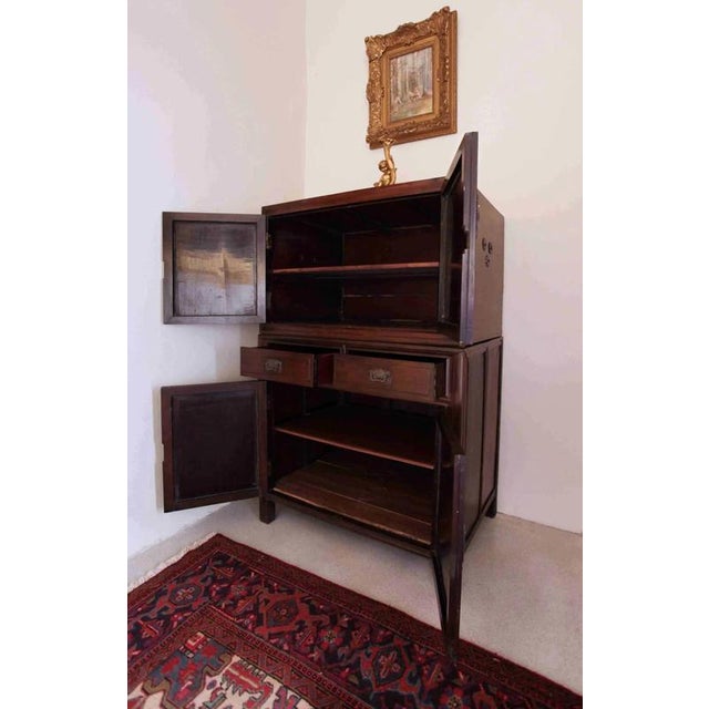 The cabinet is made of wood. Original fittings. The doors have fittings decorated with pearls. Shellac polish. Good...