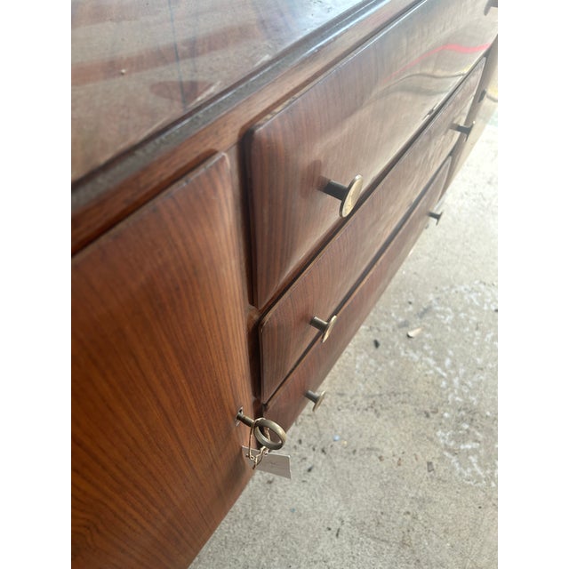 Rosewood veneer credenza with figural nude relief panels atop marble base. Mid century Italian. No makers mark.