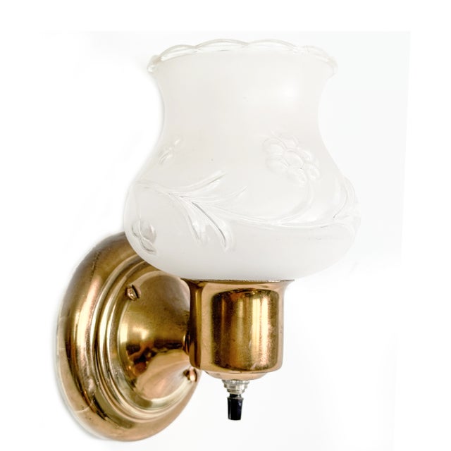 Bring authentic Mid-Century charm to your space with this original vintage brass wall sconce featuring its beautiful...