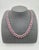 This stunning necklace showcases a series of 54 oval-cut rubies, totaling 30.20 carats, set in luxurious platinum. Each...