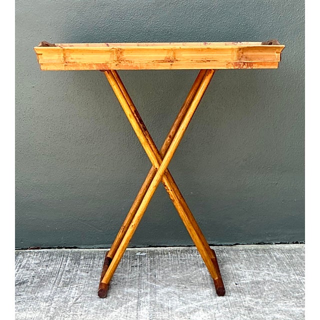 This elegant vintage tray table is a masterclass in organic texture and functional design, perfectly capturing the relaxed...