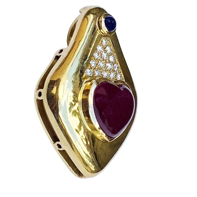 This mid century European exemplary in 18k yellow gold dome pendant/Pin/Brooch , is 38mm by 28mm in size. It is...