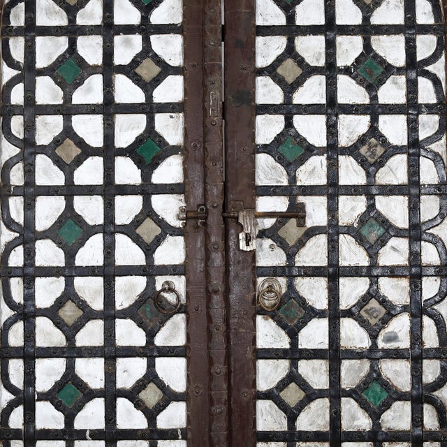 Antique Indian Teakwood and Painted Iron Compound Door, from Rajasthan, c. 1880. The iron clad door panels with a...