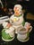 vintage Porcelan tea service includes creamer, teapot and sugar bowl. Features Hens & Chicks as the theme. adorable little...