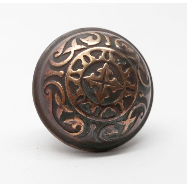 This Vernacular style four fold knob is made of cast iron with bronze plating and was made by Penn in the 1895 catalog. It...