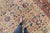 Striking and gorgeous, this hand-knotted large-sized rug details an allover floral design on a unique and rare Macarron...