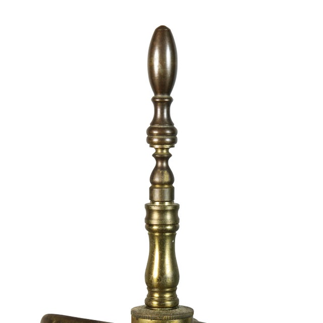 Two light with fluted column and stepped plinth with gilt accents. Bears label.