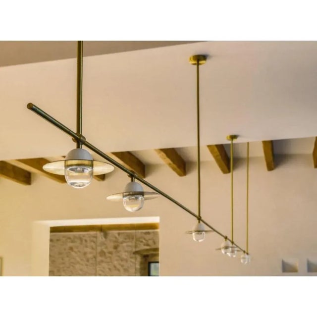 Alba chandelier by contain dimensions: d 300 x w 15 x h 100 cm (custom leght) materials: brass, 3d printed pla structure...