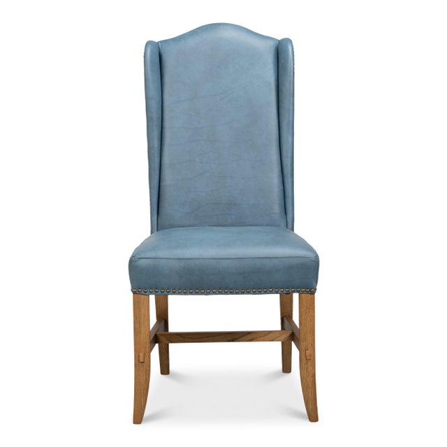 Indigo-leaning top-grain leather covers a winged back that rises to 46 inches, giving these dining chairs an unusual depth...