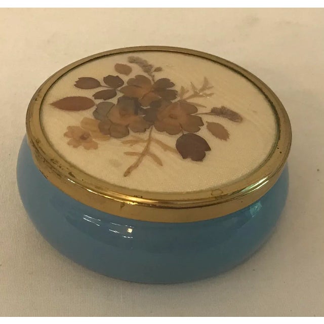 Nice blue porcelain trinket box with a lid that has dried botanical under glass.