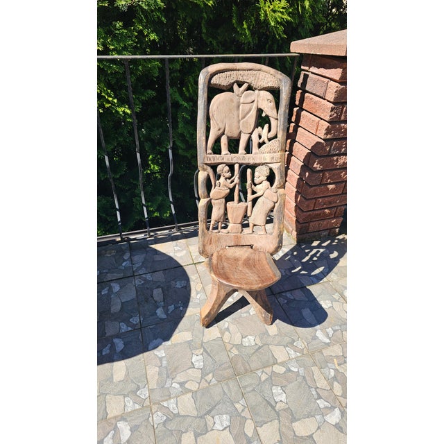 Hand-carved African tribal ceremonial chair, 1950s–1960s, made of Mpinga wood, dimensions: height 91.5 cm, width 37 cm,...