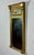 Antique 1820 American Federal Giltwood Tabernacle Mirror with Eglomise Glass This authentic c. 1820 American Federal...