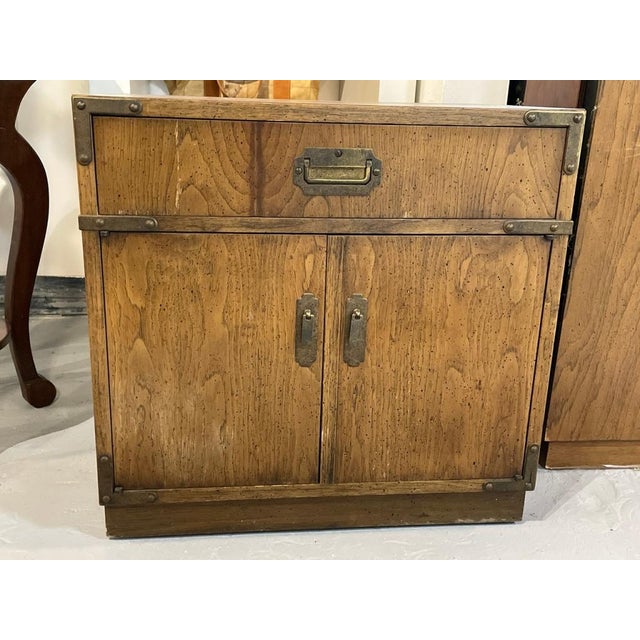 Rapids Furniture Co. Campaign-style nightstand. Vintage oak nightstand featuring brass tone recessed hardware, metal...