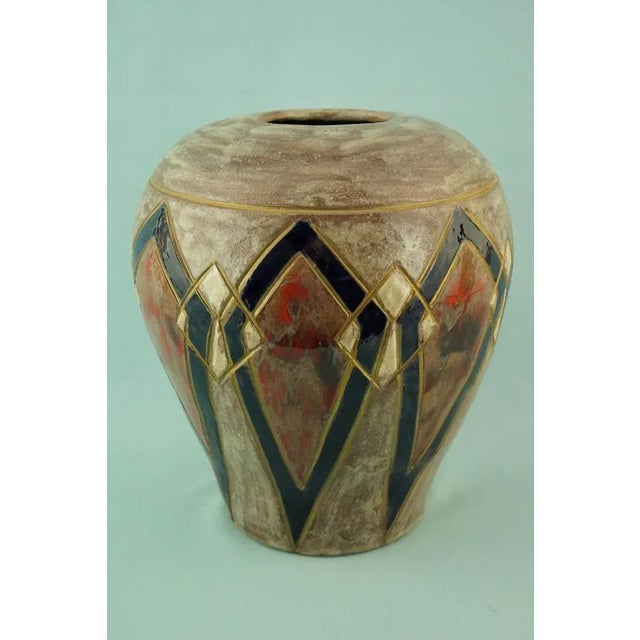 Item description: A stunning ovoid-shaped glazed majolica ceramic vase with a narrower truncated base that widens towards...