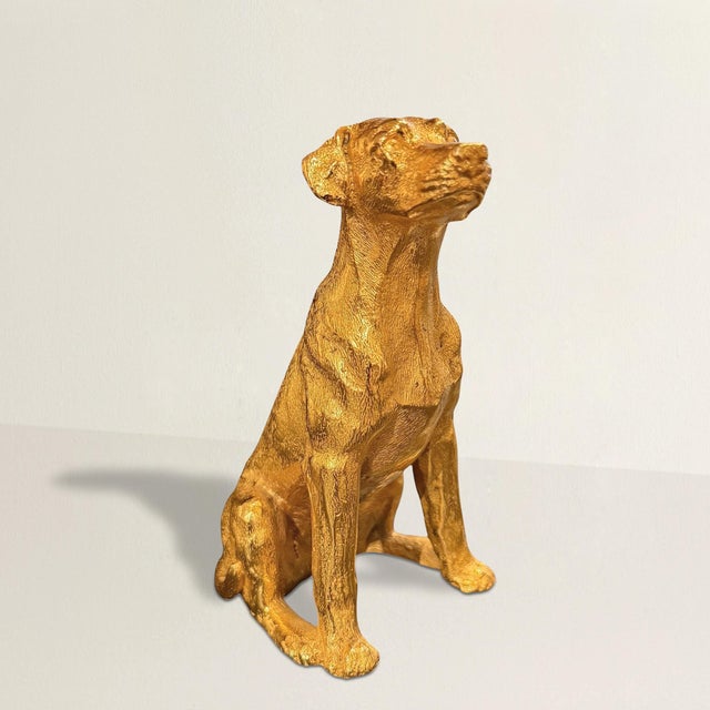 A small masterpiece of devotion, cast in gilt bronze in Italy. This 21st-century Labrador retriever sits upright, composed...