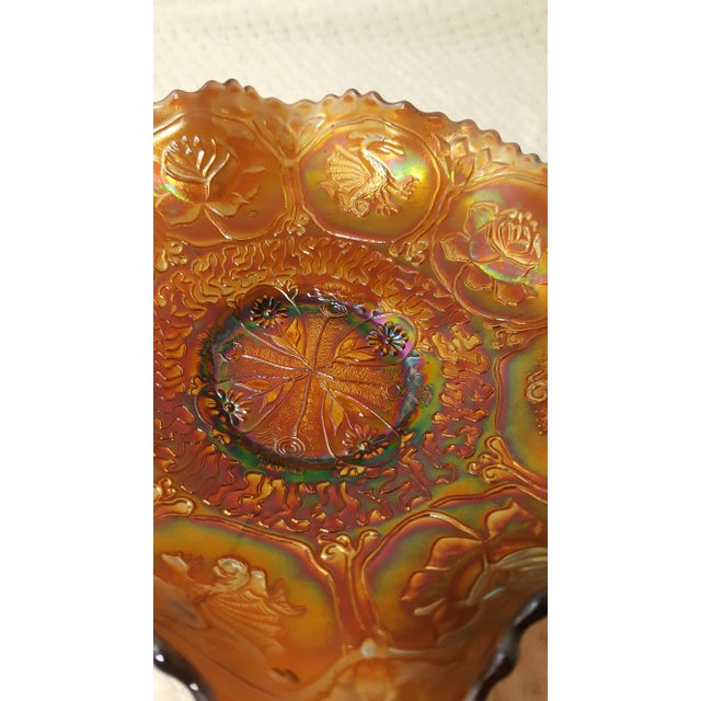 The beautiful dragon and lotus pattern is a collectors dream. This is a very beautiful amethyst Carnival glass color. It...