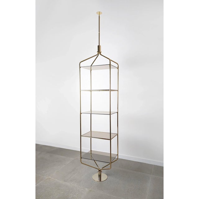 Spectacular Mid-Century Tension Pole ceiling-to-floor shelving design in brass from the 1960s, a truly unusual and...