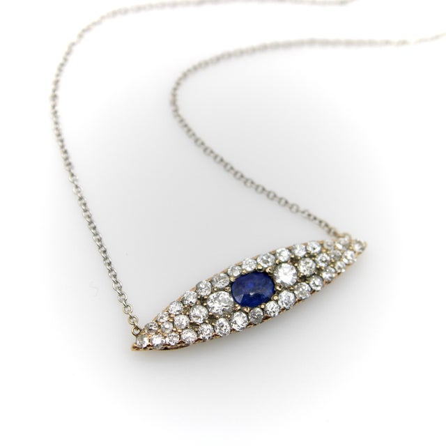 At first glance, this 14k gold necklace is reminiscent of an eye. Originally a Victorian era navette ring circa 1890, this...