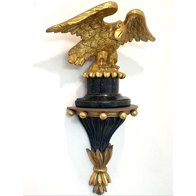 This gilded bald eagle is mounted on a faux marble perch, which then can be set upon a matching corbel. Or the eagle can...