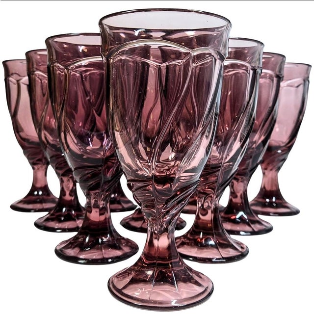 These ten plummy Purple goblets Swirled like a kindergartener that's found herself in a flowy spring dress. The glasses...