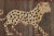 Hand-knotted in wool and originating circa 1950-1959 from Afghanistan, this 2x4 vintage Gabbeh pictorial runner originates...