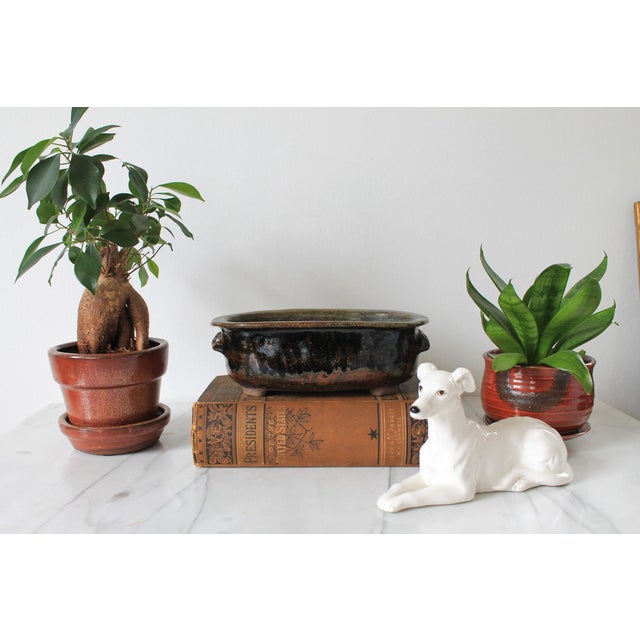 Vintage footed studio art pottery planter. Included two drain holes. Signed on bottom. No chips or cracks.