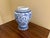 A classic blue and white ginger jar form vase, decorated throughout with delicate Chinoiserie floral motifs. The pattern...