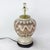 This striking pair of vintage ceramic table lamps features a classic ginger jar silhouette elevated by a bold, earthy...