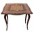 Elegant Louis XV style fold-over games table with elaborate floral marquetry The shaped top features a central musical...