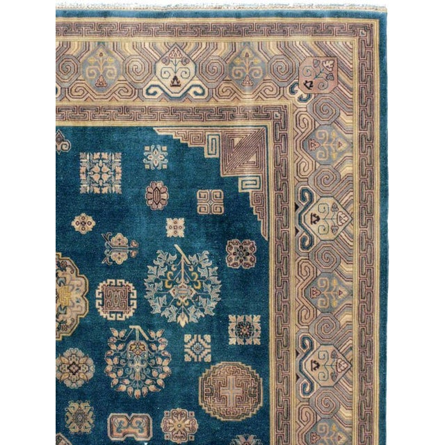 A vintage Chinese carpet with a Khotan design from the second quarter of the 20th century. Measures: 9' 0" x 11' 8"