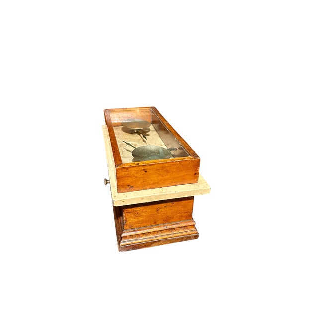 This wonderful apothecary scale is made of wood and marble and metal scales. It's a great decorative piece for a built in...