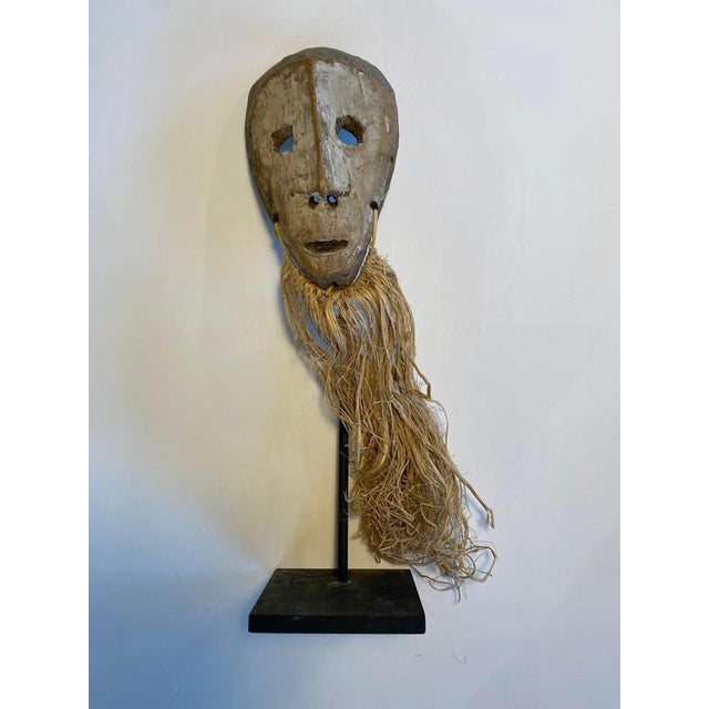 Democratic Republic of Congo Lega mask Wood / raffia and kaolin Late 19th century H mask alone 18 x W 10 x D 4cm with...