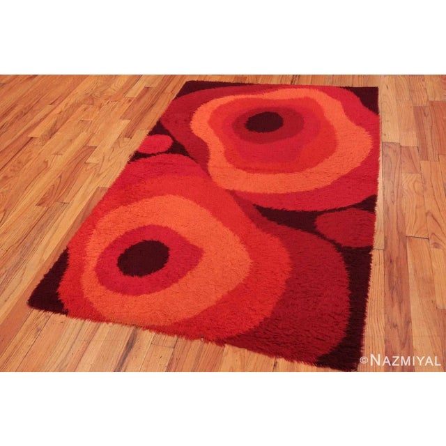 Quintessentially mid-century, this Swedish rug, with its pallet of red and concentric ovals, is an abstract delight....