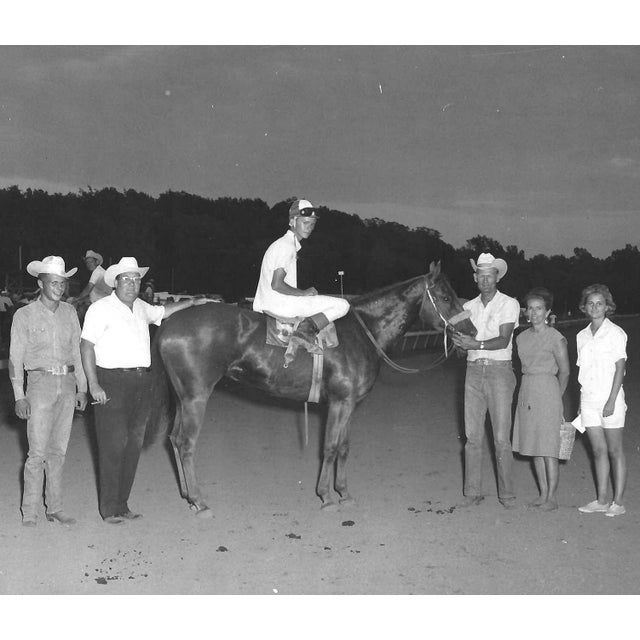 July 1965 black and white photograph of Miss Bar Flash in the winner's circle at Marble Downs in Carthage, Missouri....