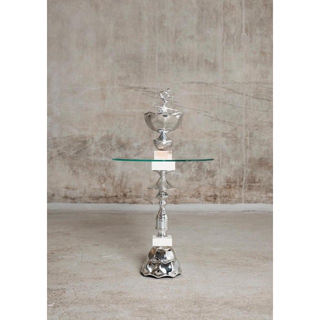 The Alpine Skier table by Flétta Dimensions: 74 x 46 cm Materials: silver, white, rose marble Trophy is a collection of...